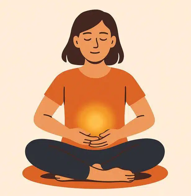 Person sits quietly, hands on lower abdomen, concentrating on breathing to find inner balance.
